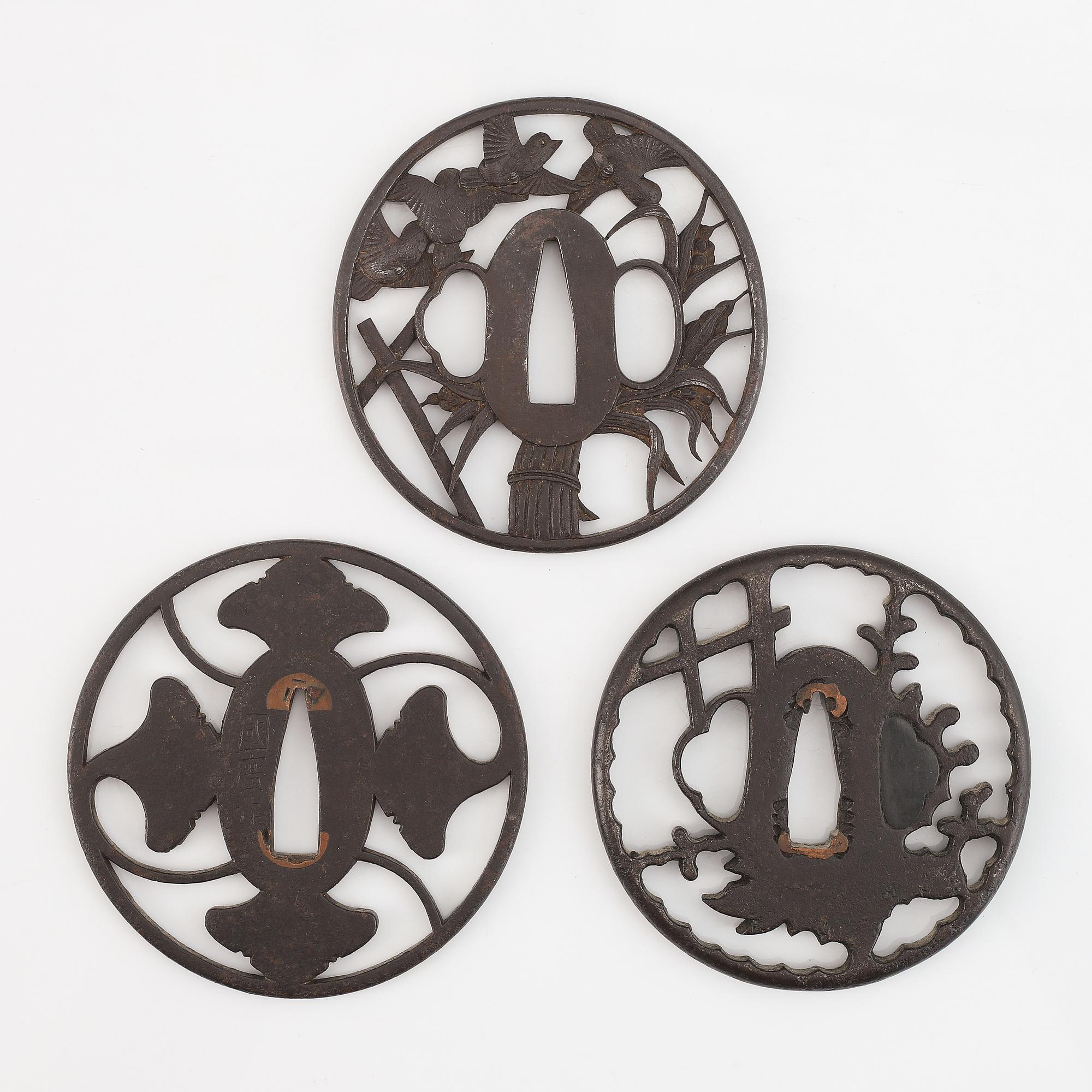 Three Japanese iron Tsubas, late Edo, one signed Kunihiro.