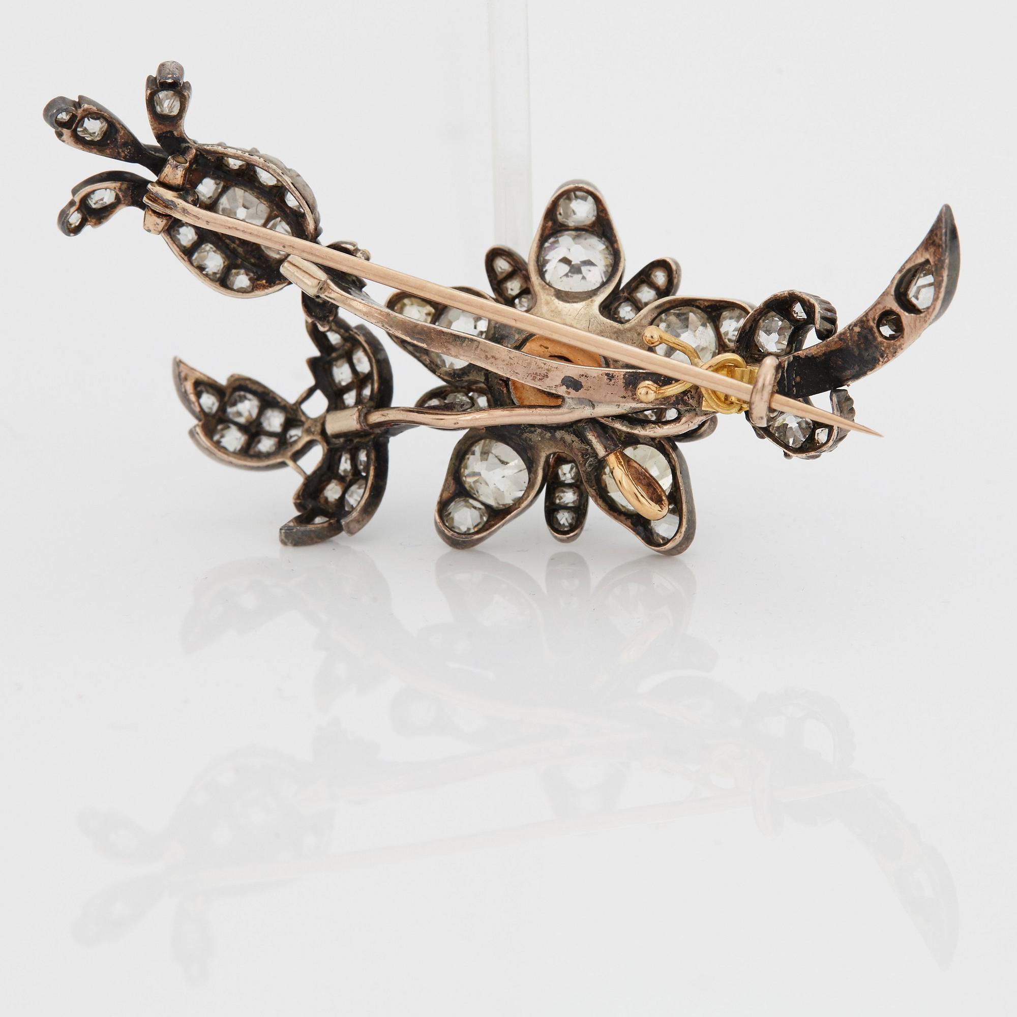 A BROOCH set with old-cut diamonds.