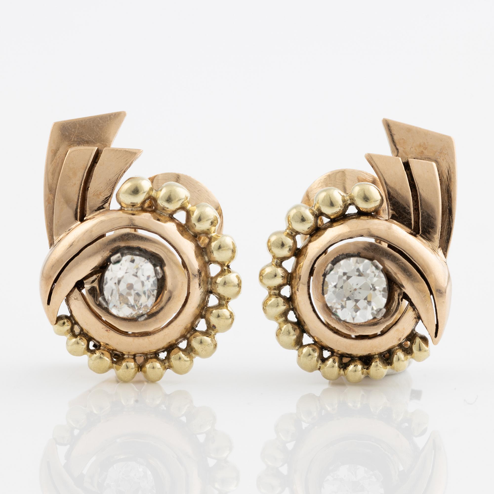 A pair of earrings in 14K gold set with old-cut diamonds.