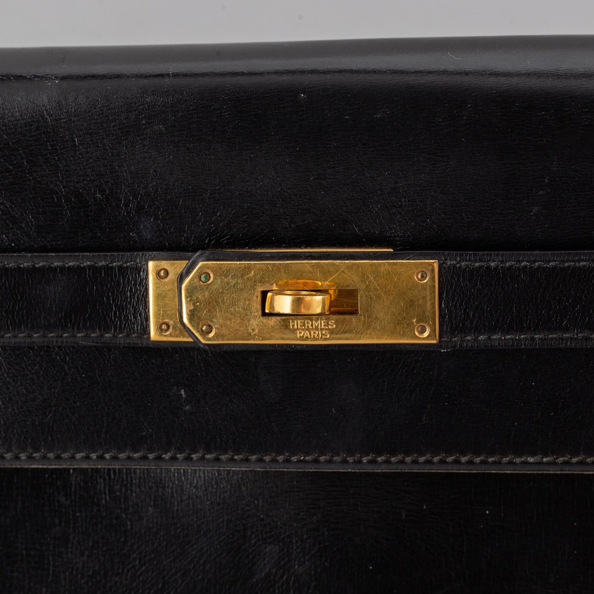 Hermès,a black leather 'Kelly 32' handbag, 1975.