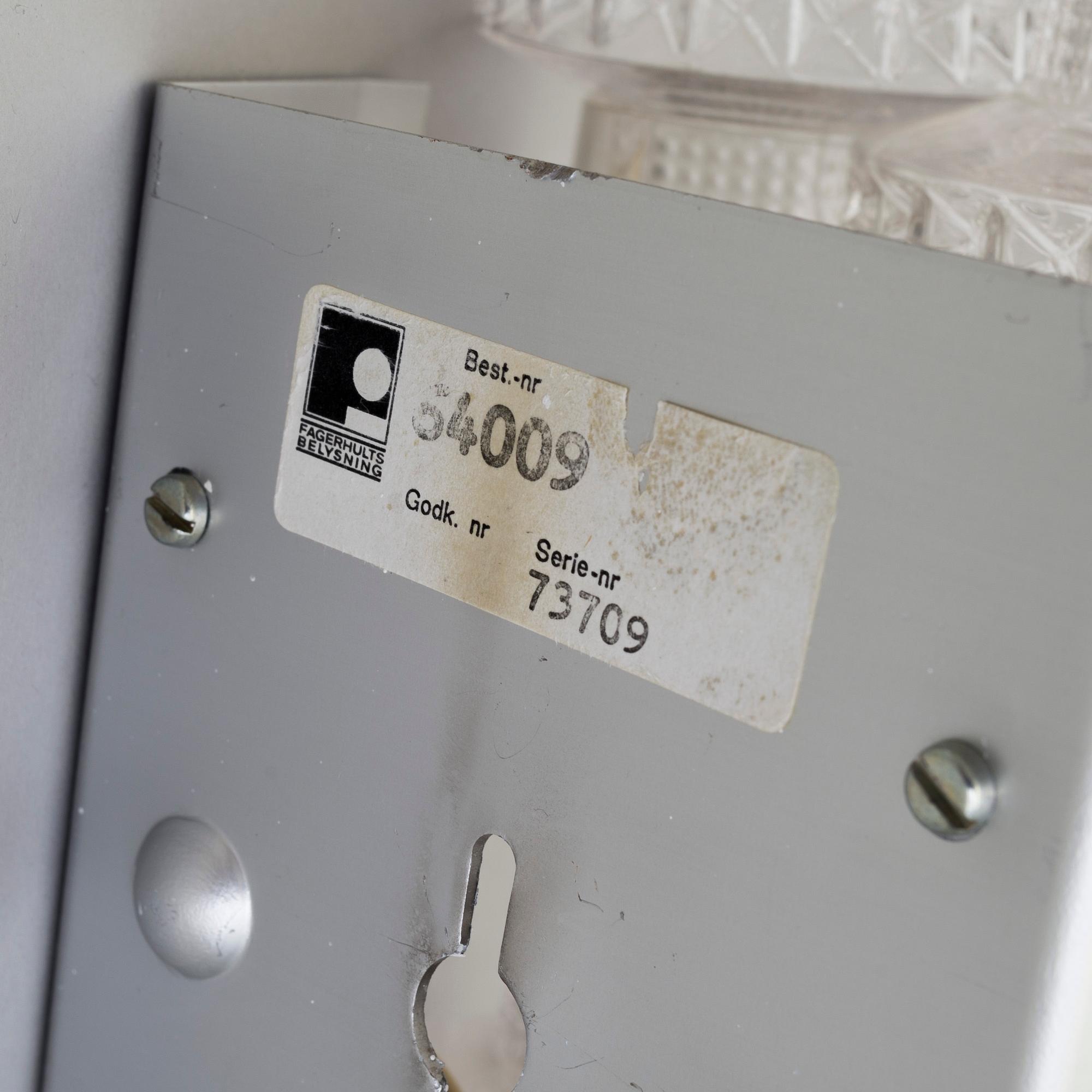 A pair of wall lamps by Gert Nyström for Fagerhult, second half of the 20th century.