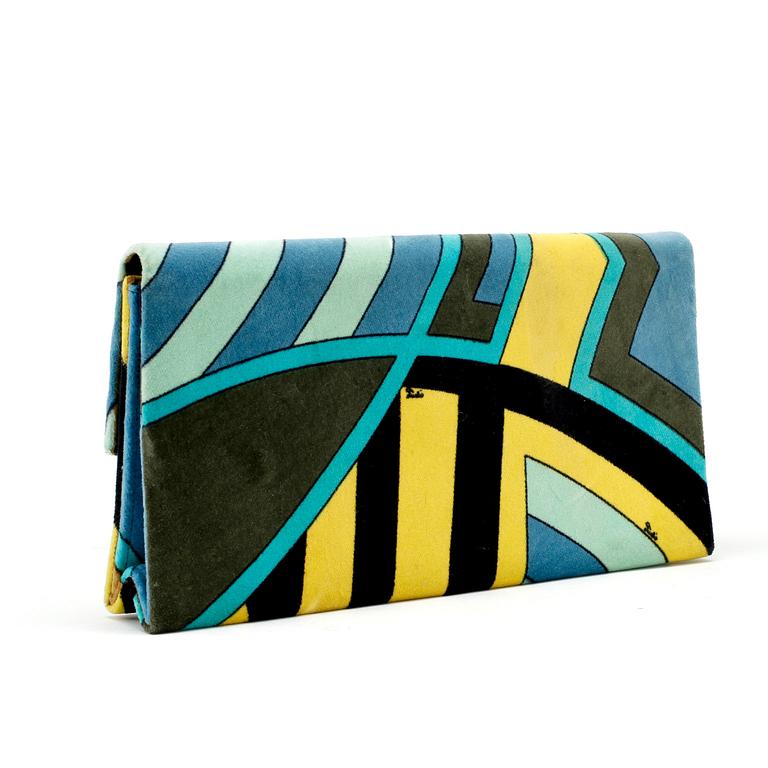 EMILIO PUCCI, a velvet clutch.