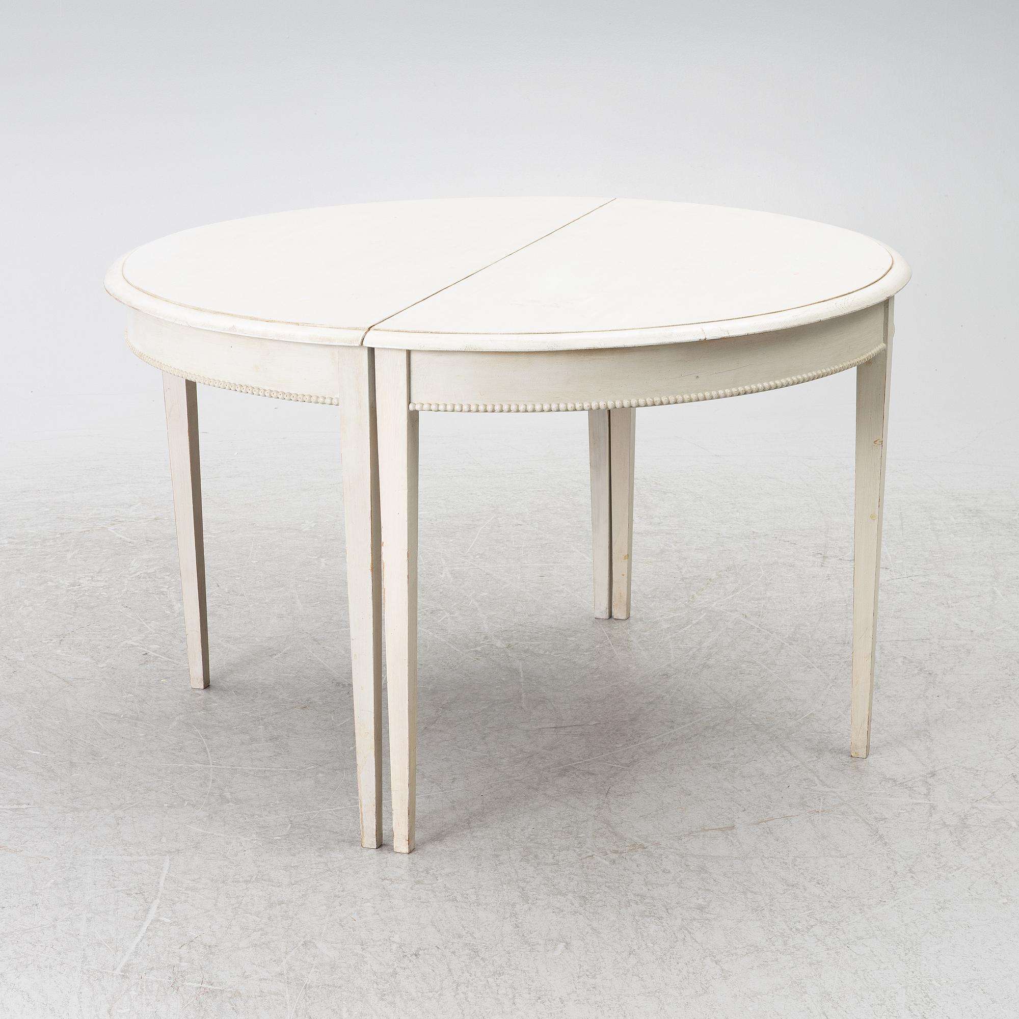 A Gustavian style dining table, late 20th Century.