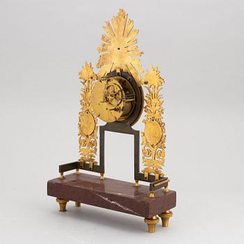 An Empire mantle clock, first half of the 19th Century.