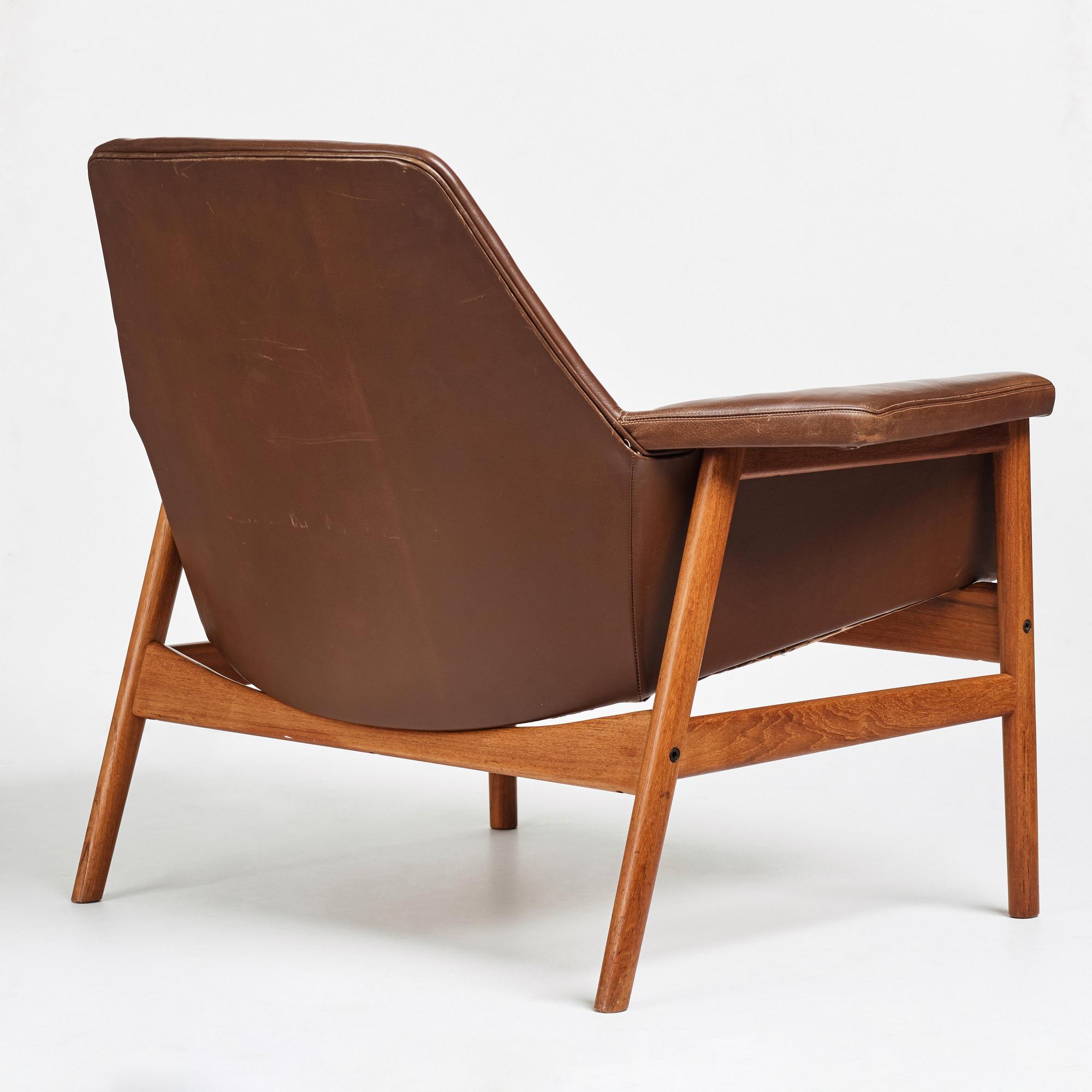 Ib Kofod-Larsen, a teak and brown leather easy chair, Olof Perssons Fåtöljindustri (OPE), Sweden, 1950-60's.