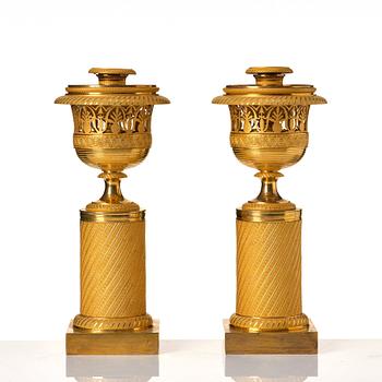 A pair of French Empire candlesticks, early 19th century.