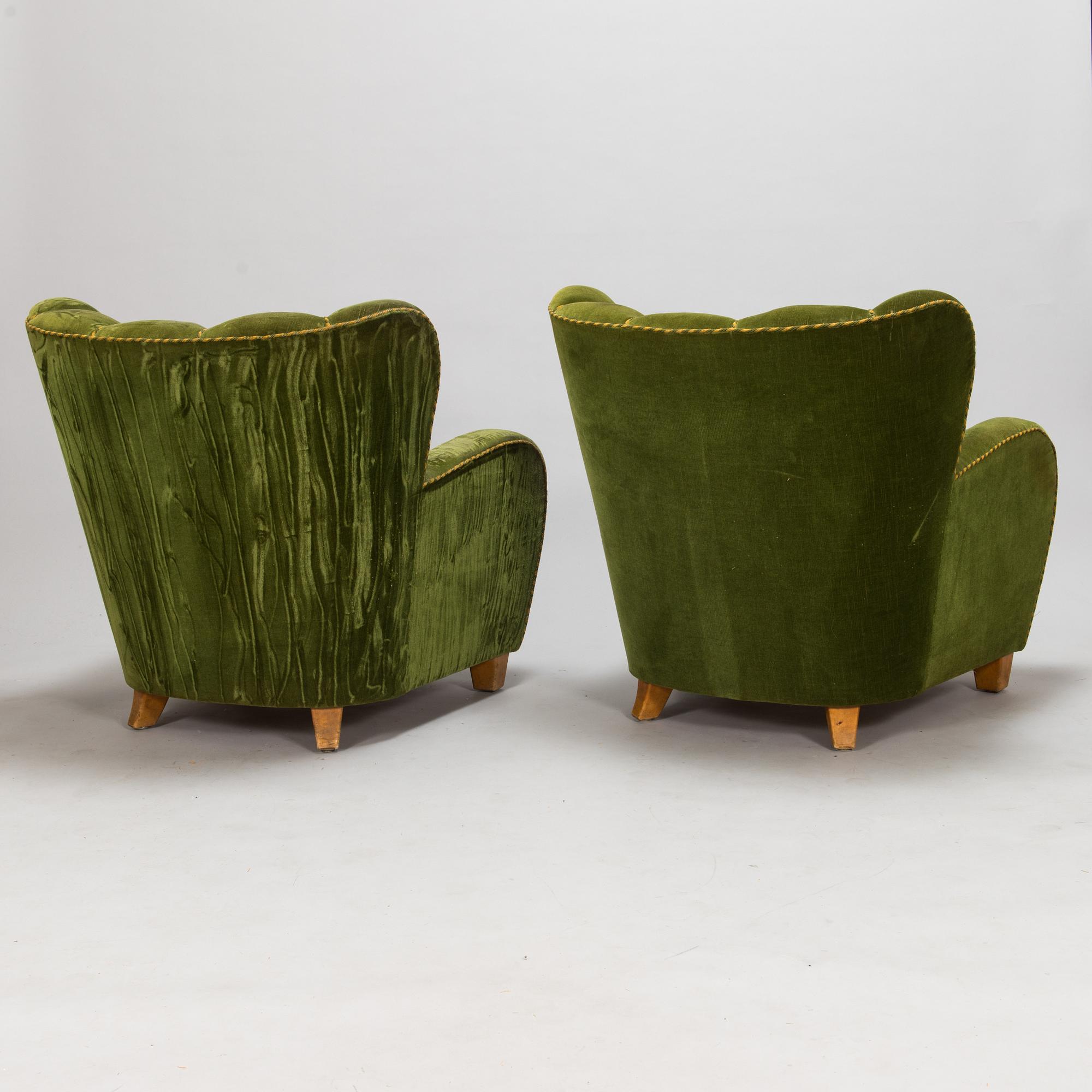A pair of 1950s armchairs.