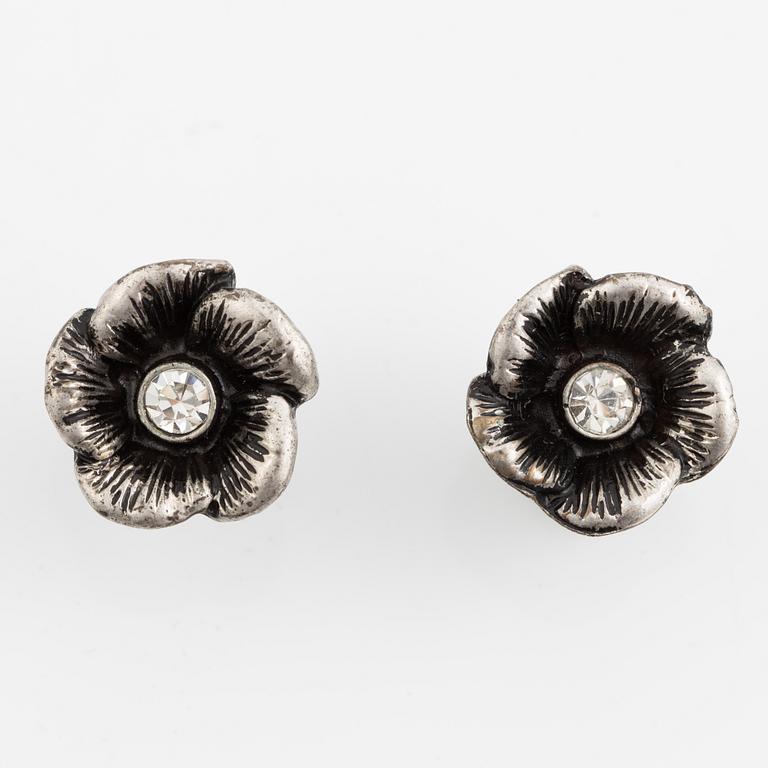 Necklace with matching earrings, white metal in floral design with glass stones.