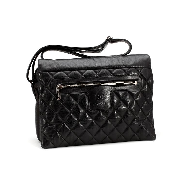 CHANEL, a quilted black mens messenger bag.