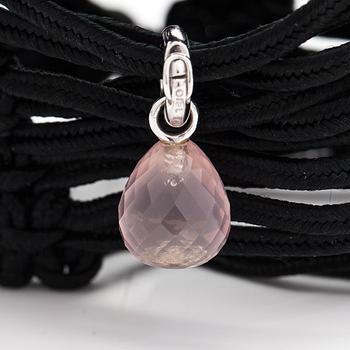 Ole Lynggaard, A satin like band bracelet with an 18K white gold and rose quartz "Sweet drops" pendant.