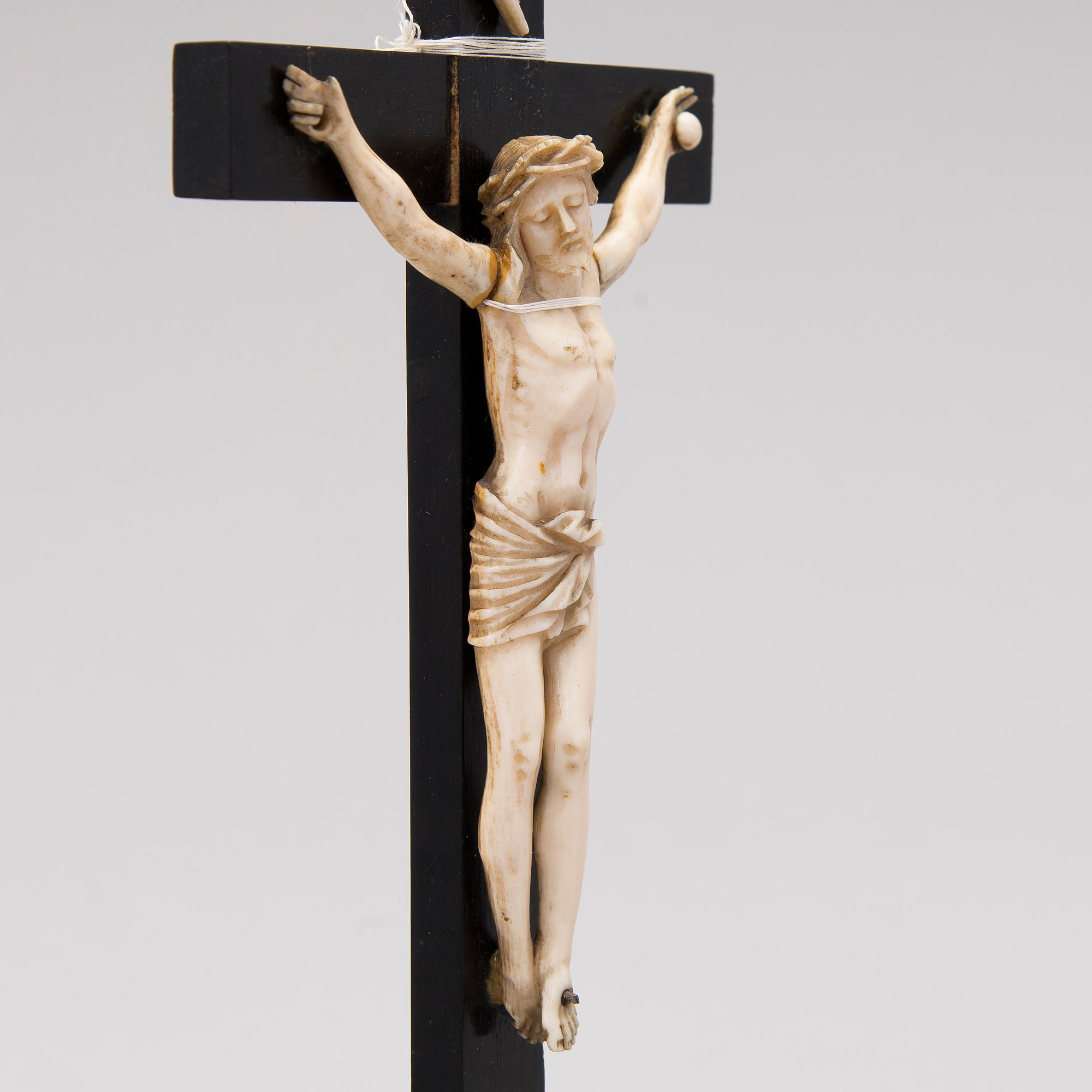 A WOODEN AND BONE TABLE CRUCIFIX with base. 19th Century.