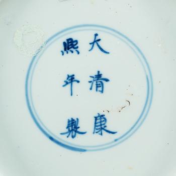 A blue and white dish, Qing dynasty, with Kangxi six character mark and of the period (1662-1722).