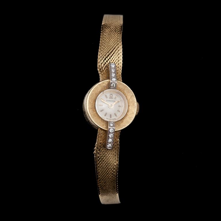 DAMUR, Omega, 18k guld samt små briljantslipade diamanter, 1900-talets mitt. Vikt ca 23g.