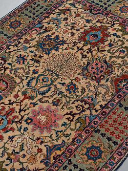 A RUG, a semi-antique Tabriz, ca 198 x 142 cm.