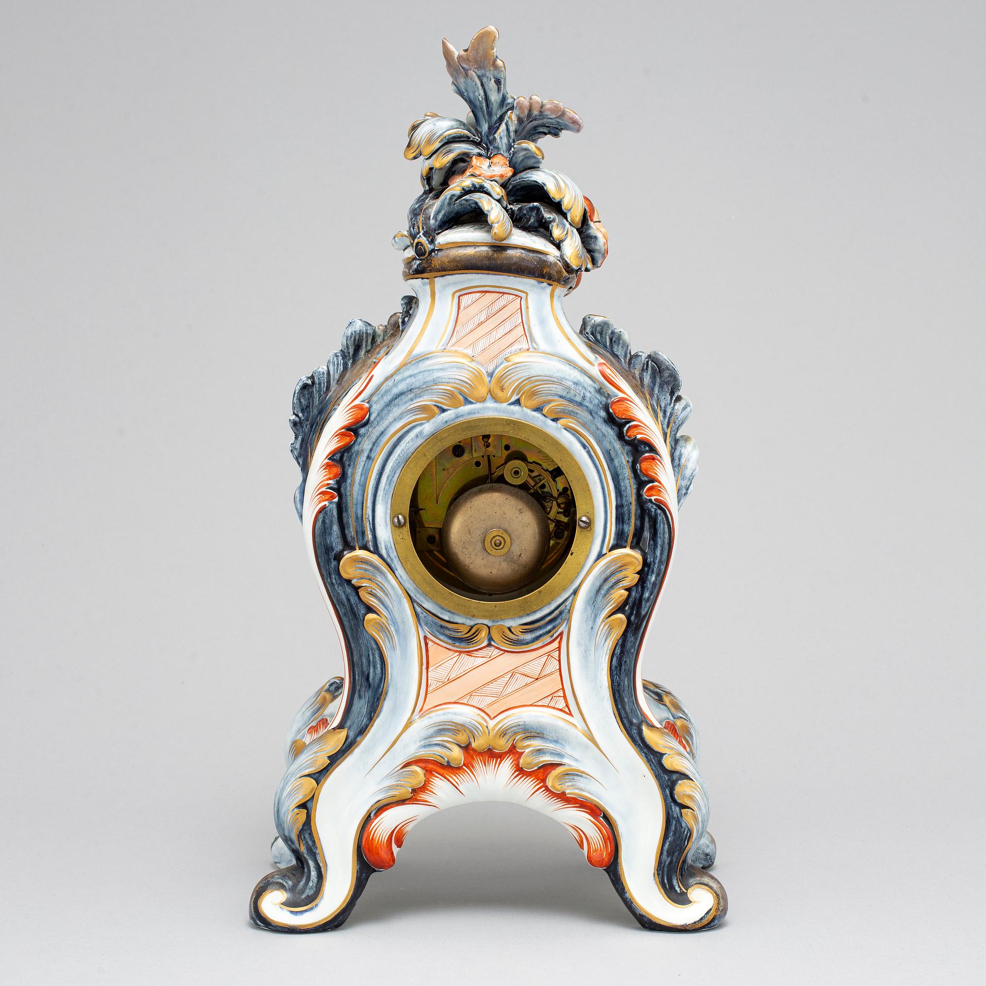 A new rococo creamware bracket clock, after Meissen model, early 20th century.