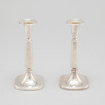 A pair of silver candlesticjs by Tore Eldh for K&EC in Gotheburg, 1970.