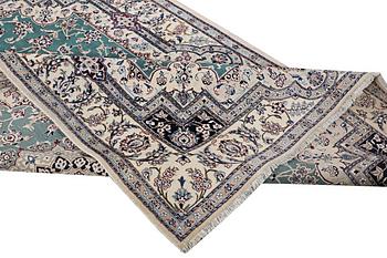 A Nain carpet, part silk, 6 laa, ca. 300 x 201 cm.