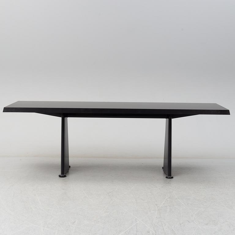 A 'Trapeze' dinner table by Jean Prouvé, Vitra, 2002.
