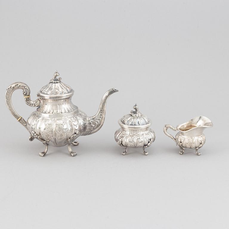 A silver teapot, creamer and sugar bowl, swedish import mark.