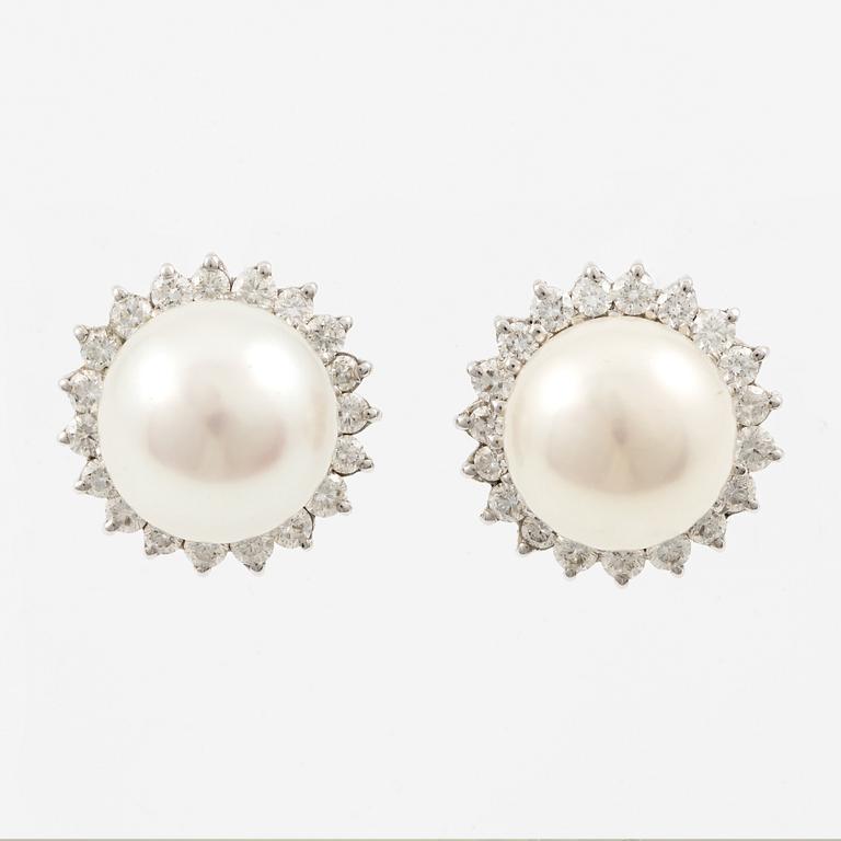 Earrings, a pair, 18K white gold with cultured pearls and brilliant-cut diamonds.