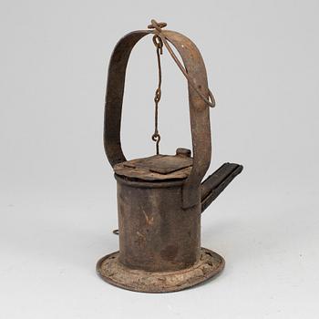 A 19th century tinplate oil lamp.