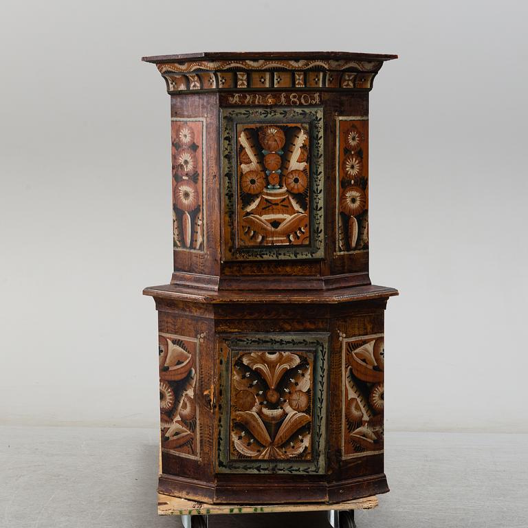 A 19th century corner cabinet.