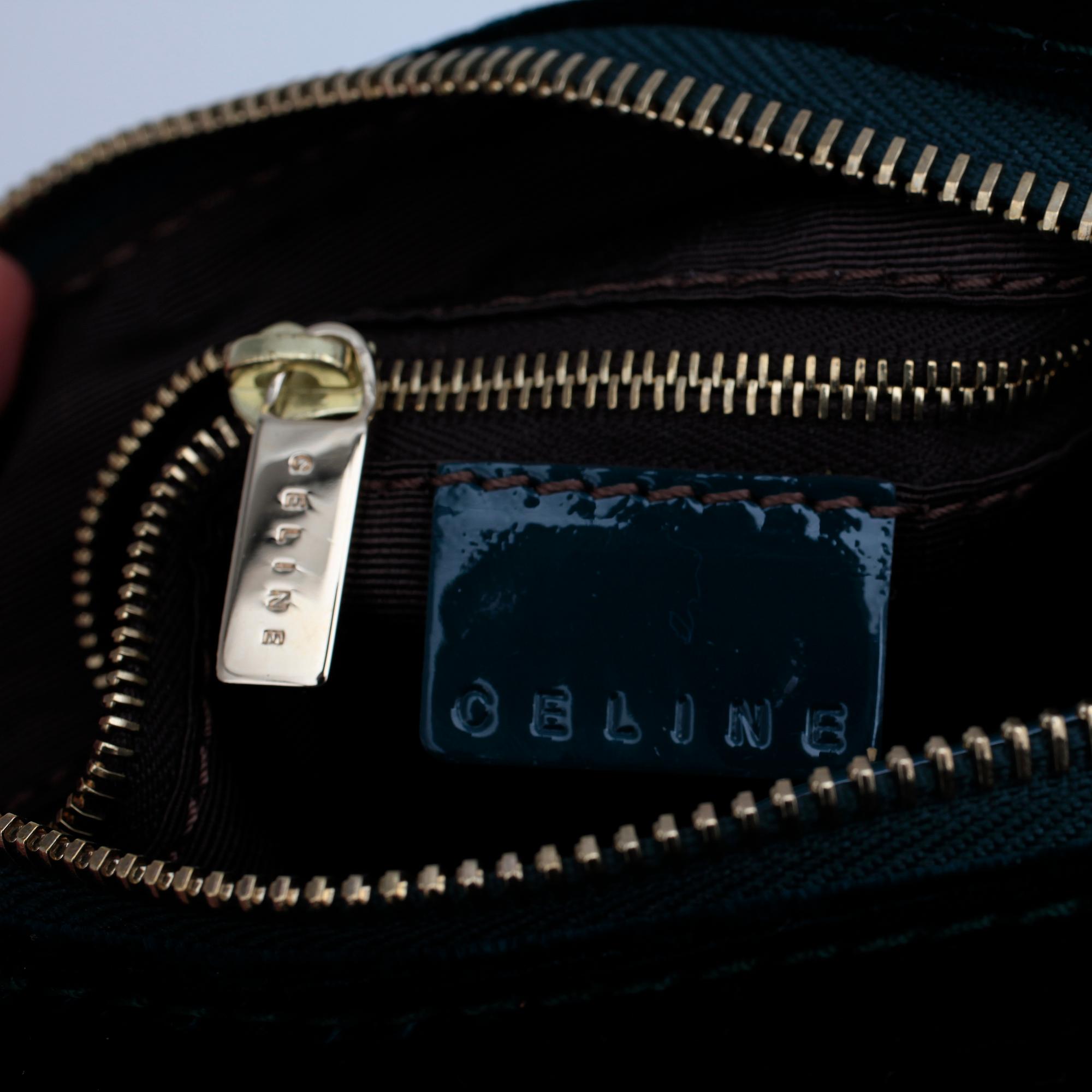 CÉLINE, a green velvet handbag.