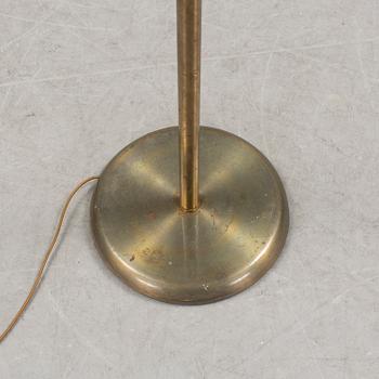 A brass floor lamp, mid 20 th century.