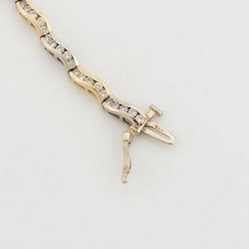 14K gold and brilliant cut diamond bracelet, with extra link.