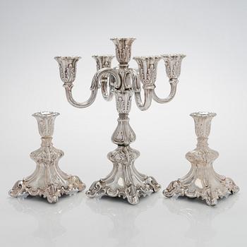 A 5-candle silver candelabra and a pair of candlesticks, silver, Auran Kultaseppä, Turku 1984.
