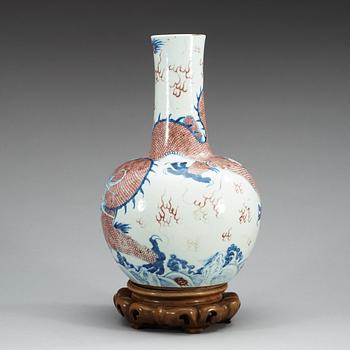 An underglaze blue and red vase with a four clawed dragon, Qing dynasty, 18th Century.