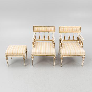 A pair of late Gustavian-style open armchairs and a stool, circa 1900.