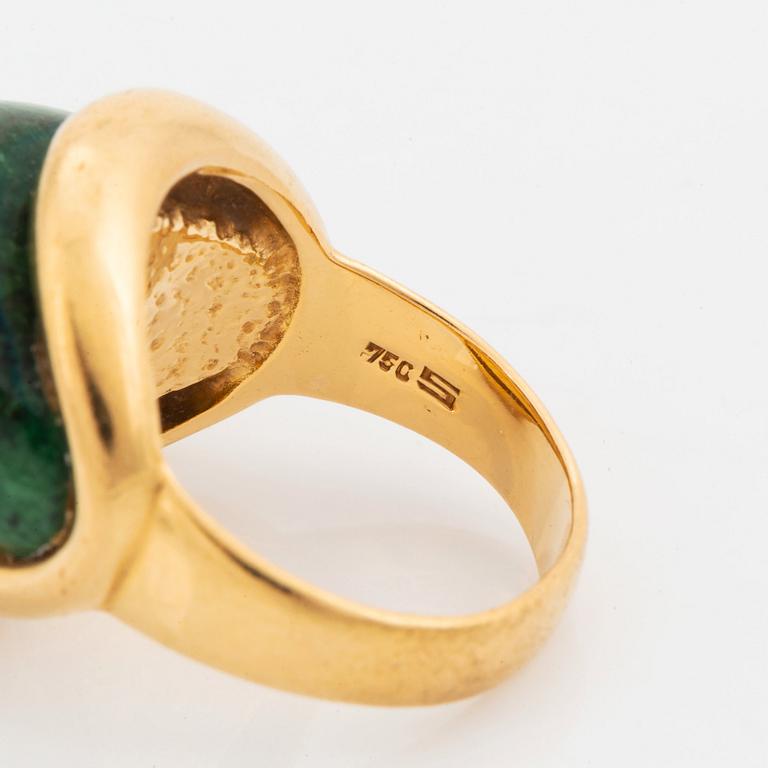 A Georg Jensen & Wendel ring in 18K gold set with a green and black stone.