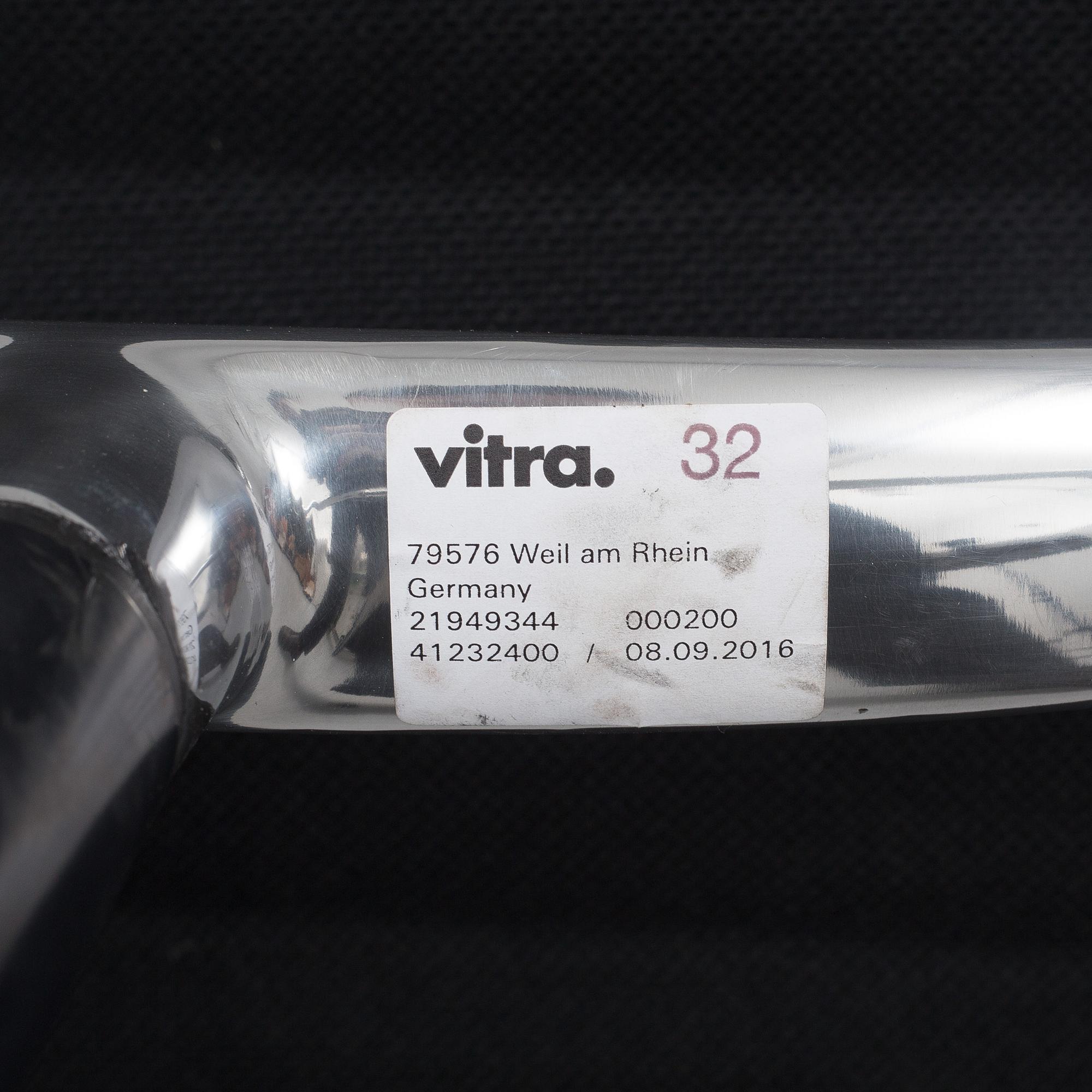 A 'EA 104 Swivel' armchair by Charles & Ray Eames, Vitra, 2016.