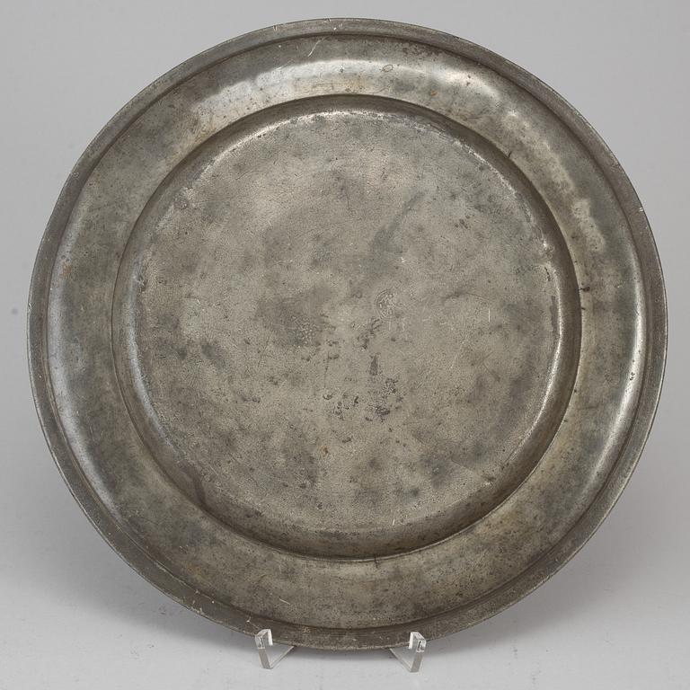 A pewter plate, dated 1787.