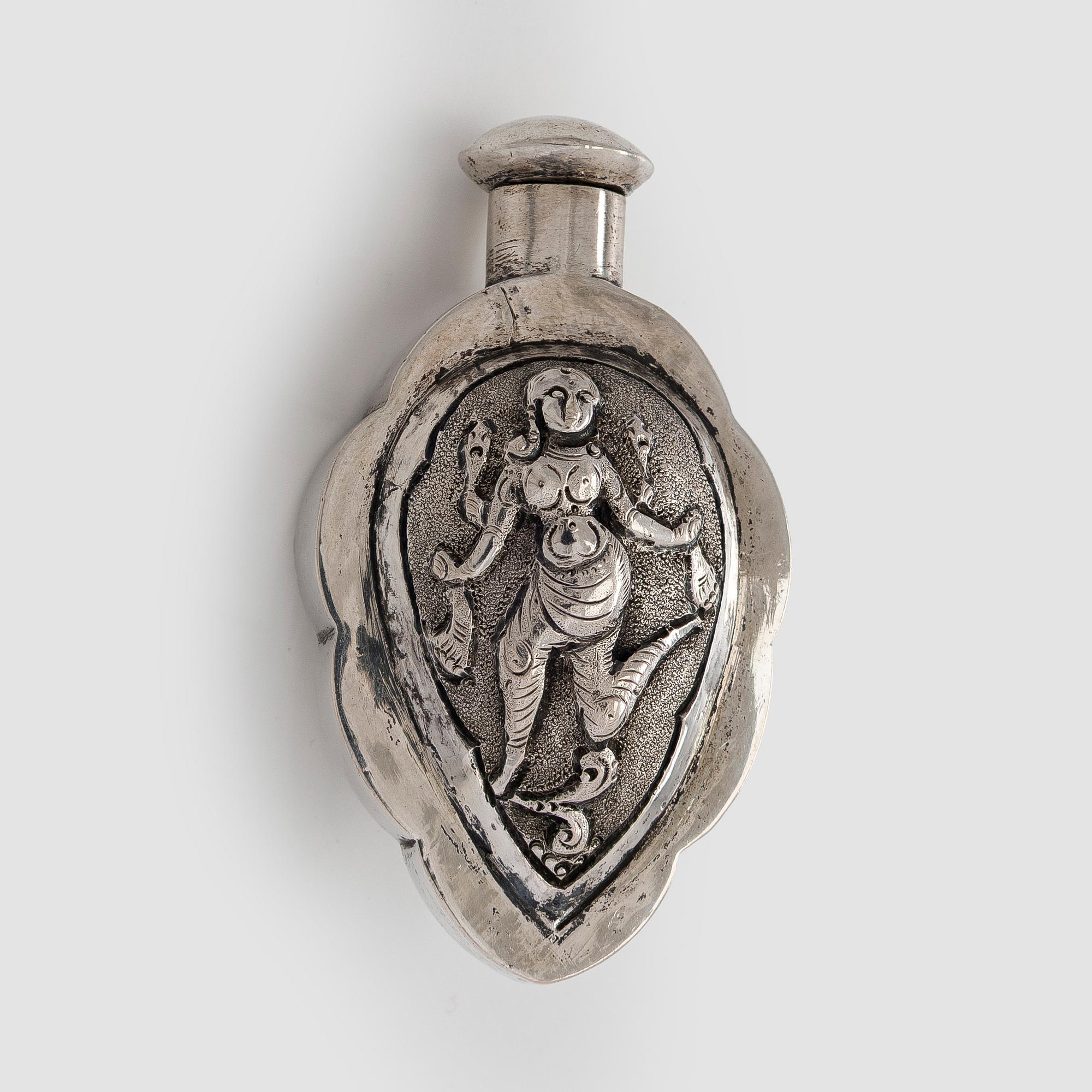 A silver bowl, Tillander import marks, 1983, and a silver snuff bottle.