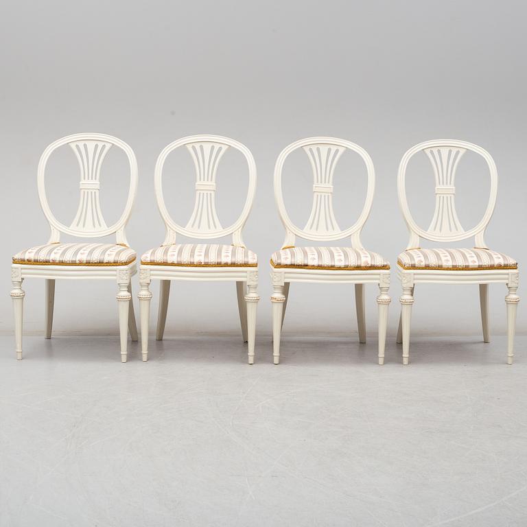 Four chairs with dinner table, late 20th Century.