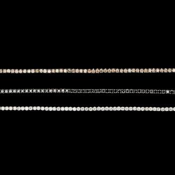 1025. 3 bracelets set with white- black- and cognacscoloured brilliant cut diamonds, tot. app. 9 cts.