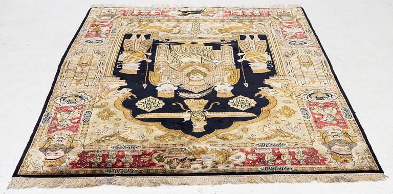 A pictorial semi-antique silk Qum rug, central Persia, c. 214 x 146 cm.
