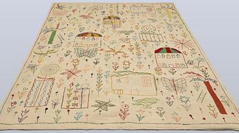 A hand-embroidered Kilim rug, c. 239 x 175 cm.