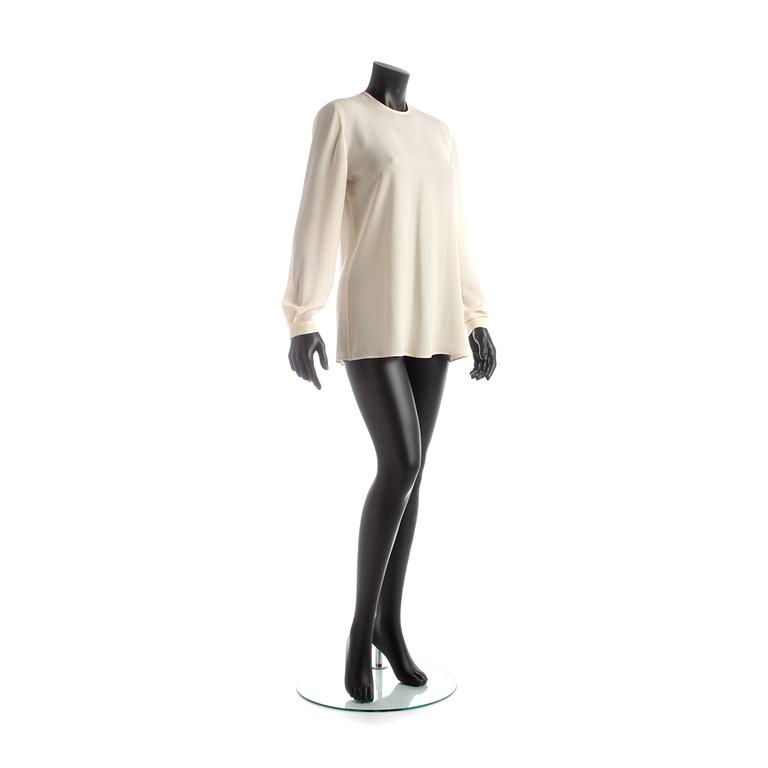 GIORGIO ARMANI, a light beige silk blouse.