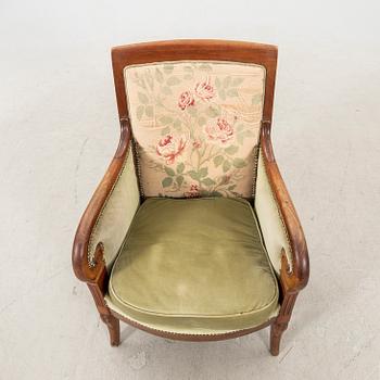 A mid 1800s mahogany bergere.
