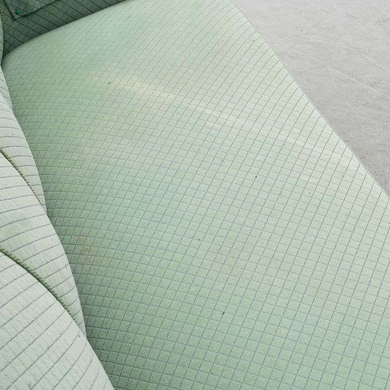 A mid 20th Century sofa and easy chair.