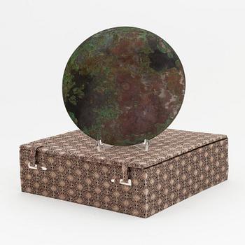 A Chinese bronze mirror, presumably Ming dynasty (1368-1644).