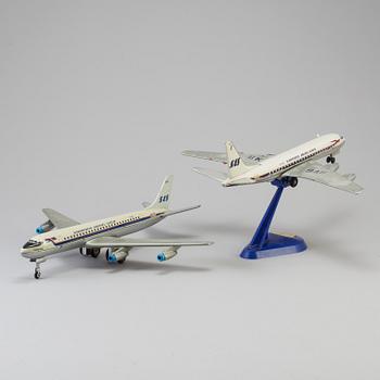 Two tinplate toy planes by Tomiyama and Arnold, Japan and Germany, 1960s.
