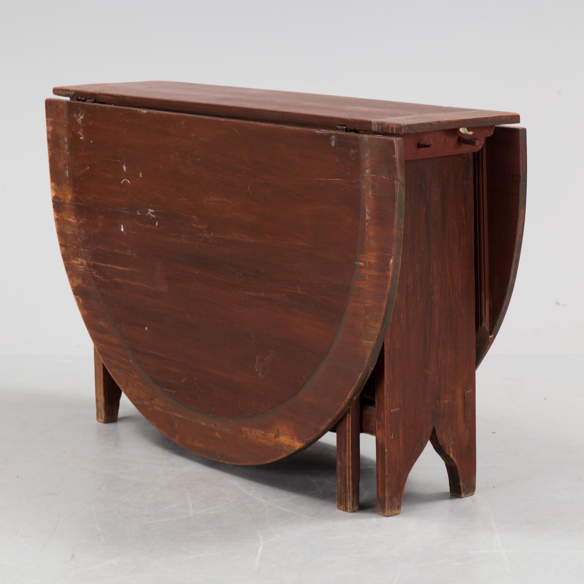 A 19th century painted flap table.