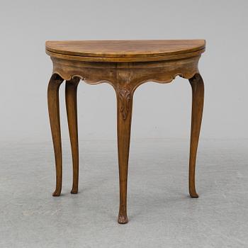 A rococo style card table from around year 1900.