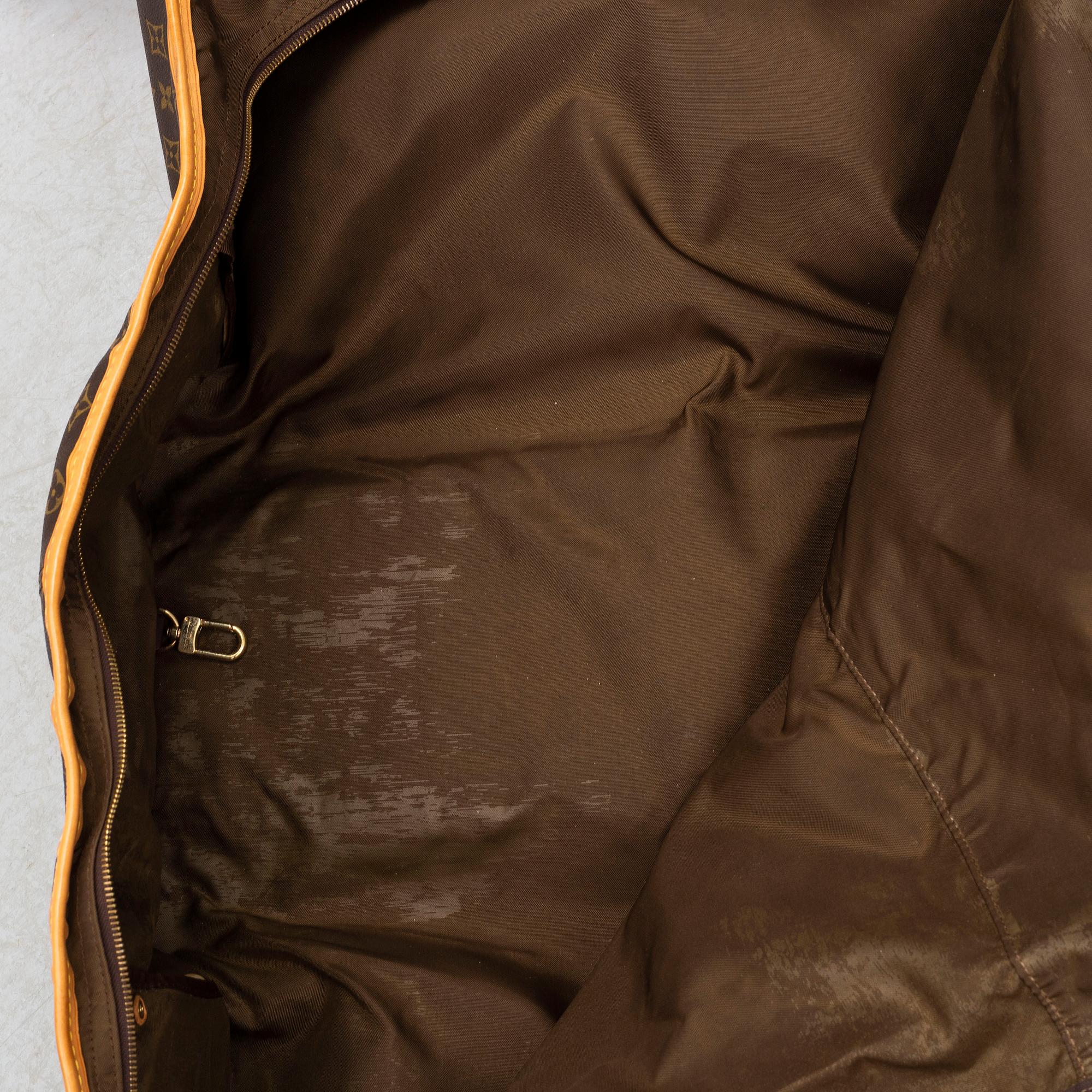 LOUIS VUITTON, a monogram canvas garment bag.