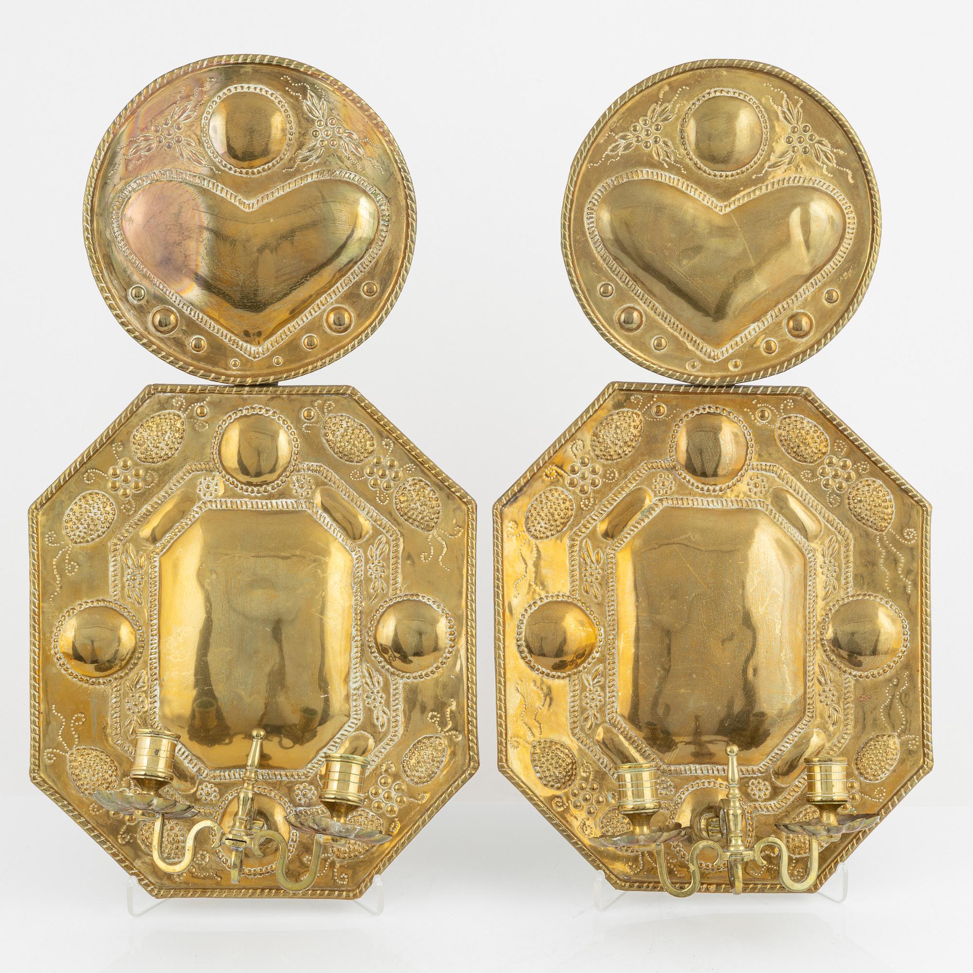 A pair of baroque style brass sconces, around 1900.