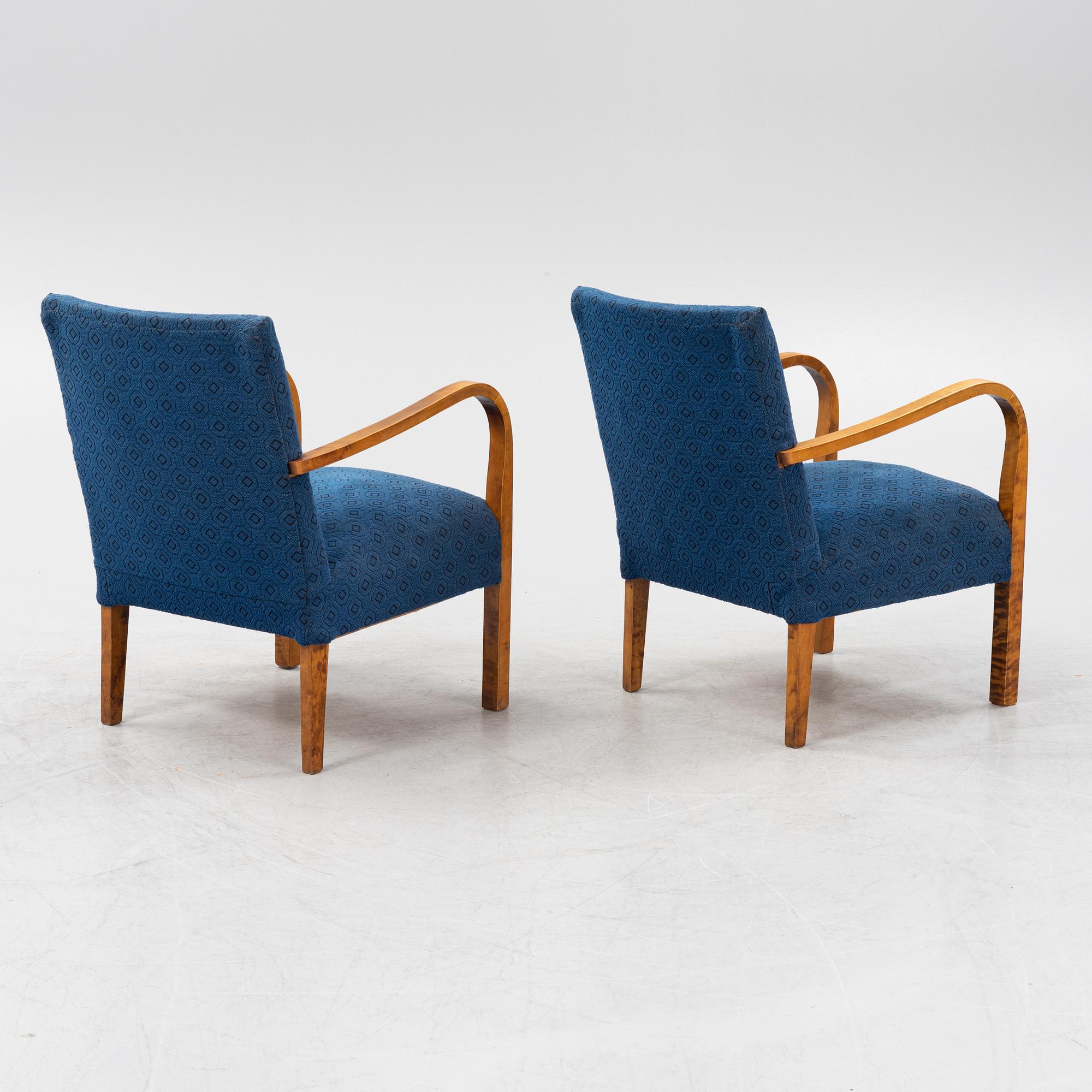 A a pair of stained birch armchairs 1930s-40s.
